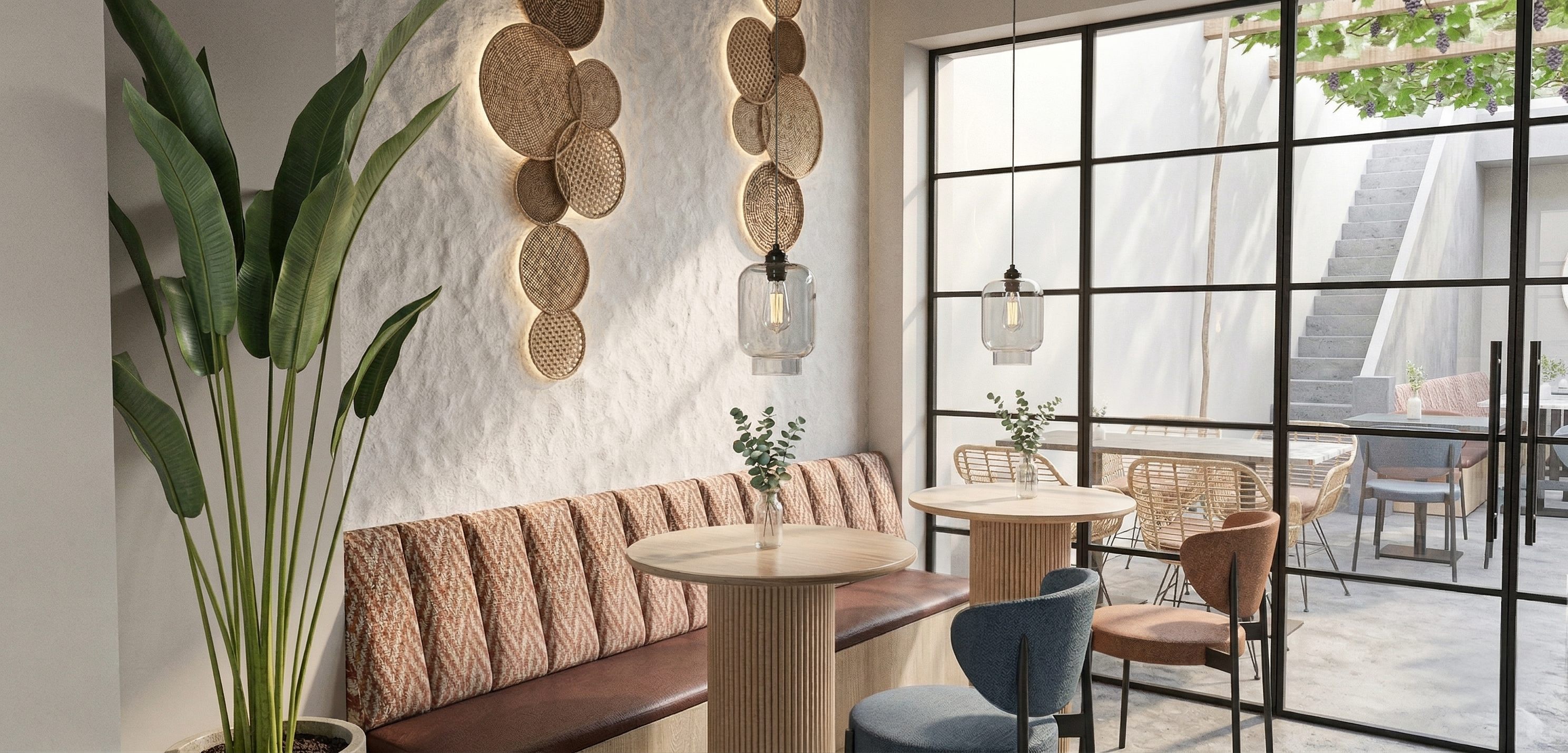 Café seating with rattan wall art and pendant lights